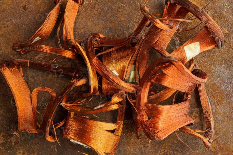 Red metal copper wire scrap materials recycling of waste from manual wire tearing. Closeup of copper waste in the form of copper wires