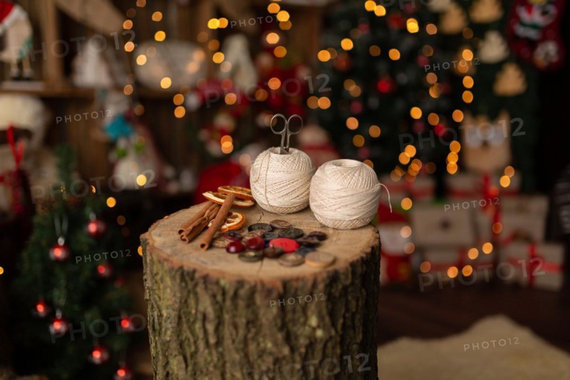 A Christmas scene with beautiful bokeh in the background and sewing tools. In studio