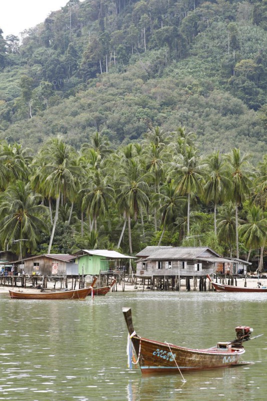 Longtail boat and wooden huts
