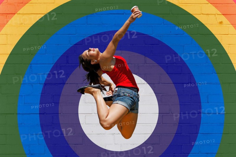 Young woman jumps for joy
