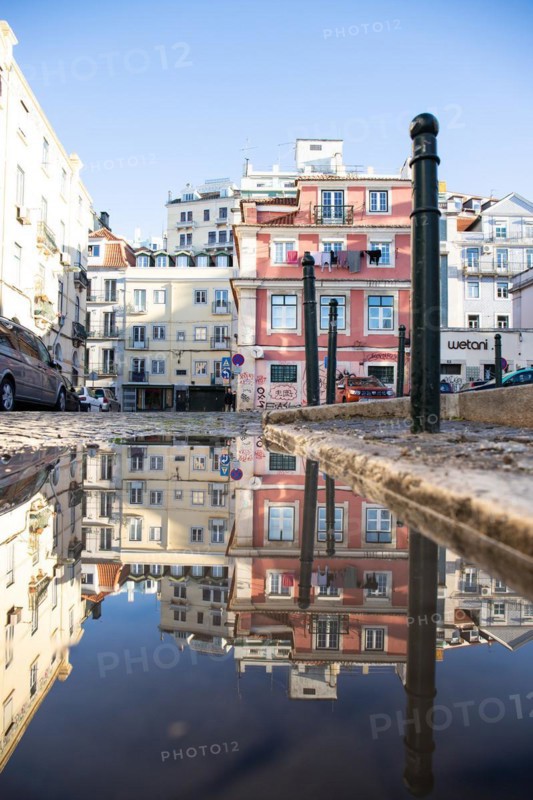Old houses in narrow alleys and historic streets. Old house fronts in the morning and in the sunshine with reflection