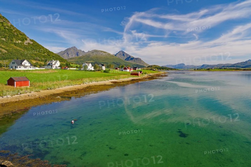 Green transparent clear water of a calm shallow fjord