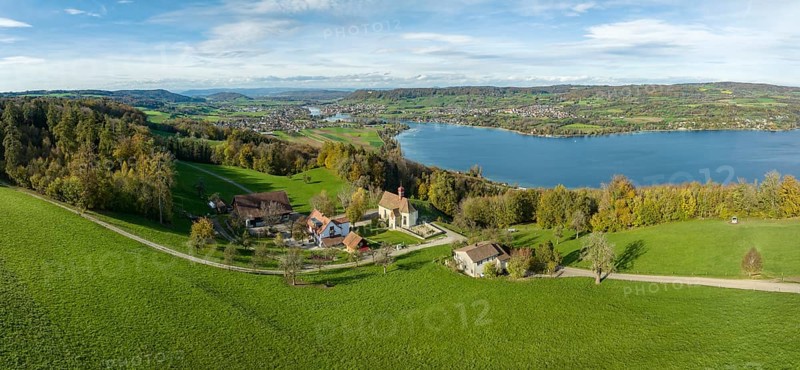 View from the Thurgau lake ridge slope to the farm settlement of Klingenzell with the Marian pilgrimage chapel of Our Lady of Sorrows