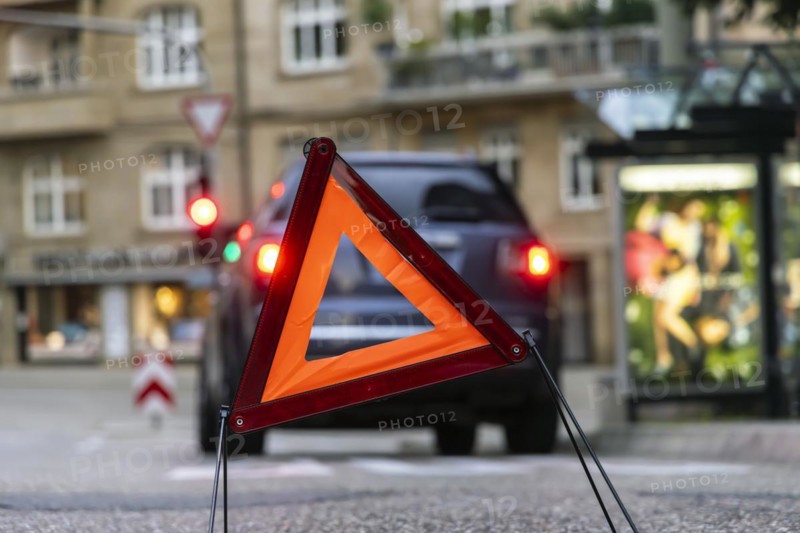 Breakdown vehicle with warning triangle