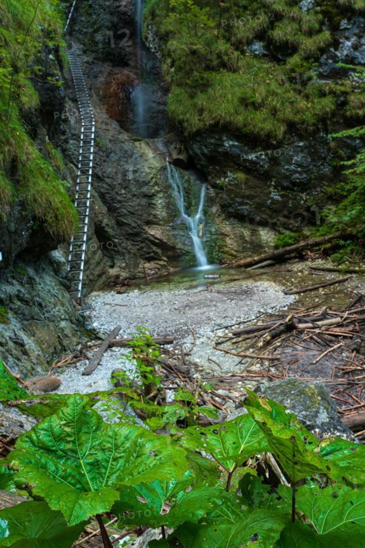 Difficul trail with ladder near the waterfall in canyon of National park Slovak paradise