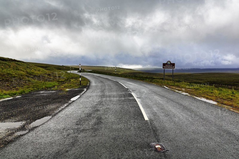 Winding country road in hilly landscape