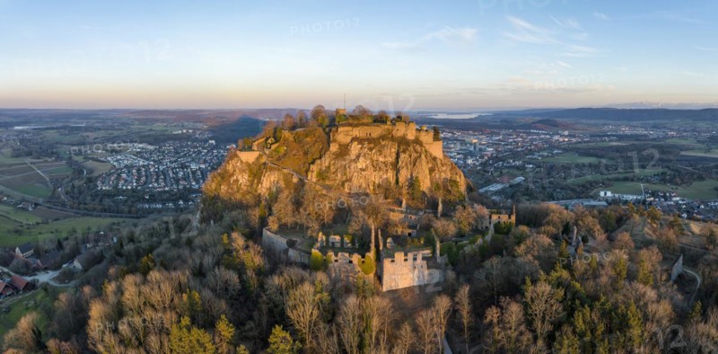 Panorama of the volcanic cone Hohentwiel with the castle ruins illuminated by the evening sun