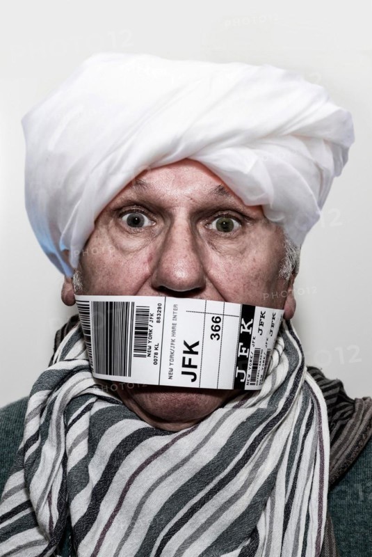Refugee for repatriation with a flying bandaroleer around his mouth