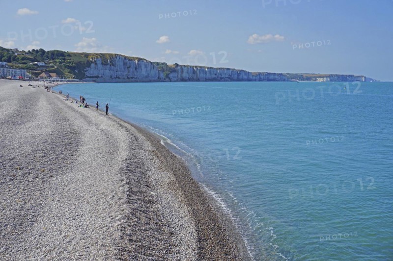 Angler on the shingle beach