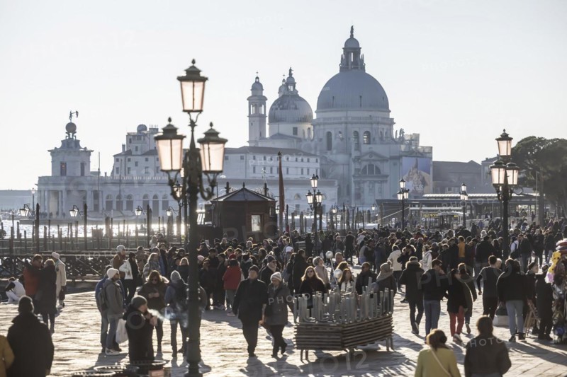 Tourists in front of the backdrop of the Basilica di Santa Maria della Salute