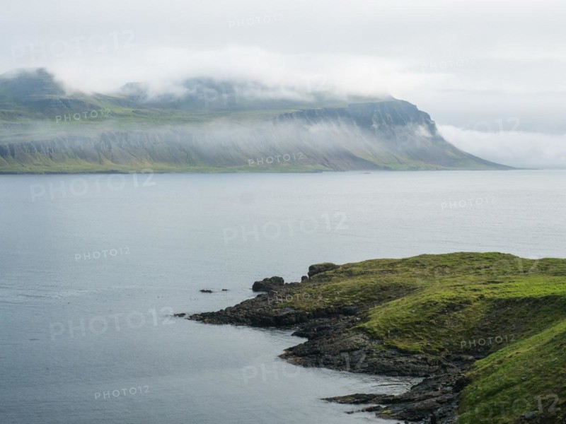 Fog over a fjord