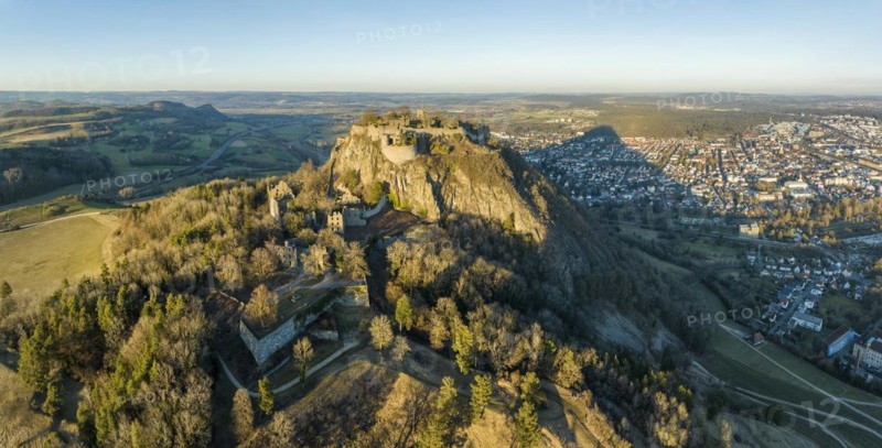Panorama of the volcanic cone Hohentwiel with the castle ruins illuminated by the evening sun