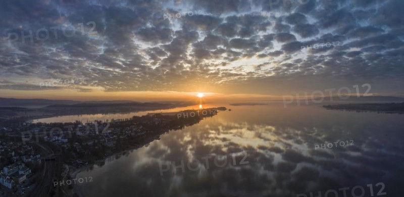 Lake Constance reflected in the morning sky with sunrise
