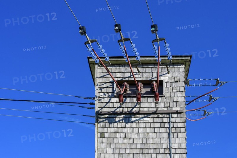 Transformer tower with wooden shingles and ceramic insulators