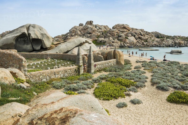 Granite rocks and cemetery on the beach