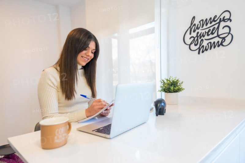 Businesswoman working with a computer smiling