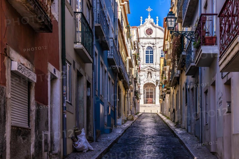Old houses in narrow alleys and historic streets. Old house fronts in the morning and in the sunshine