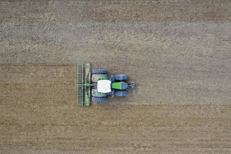 Tractor with rotary harrow