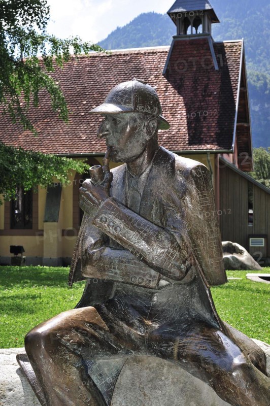 Statue of Sir Arthur Conan Doyles character Sherlock Holmes outside the English Church at Meiringen