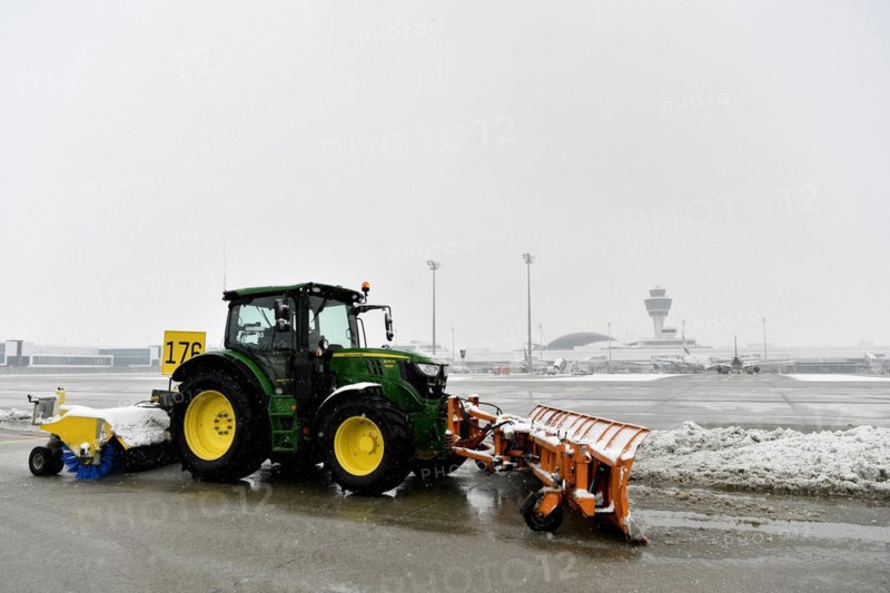 Snow clearing machines and snow removal tractors clearing snow on the east apron