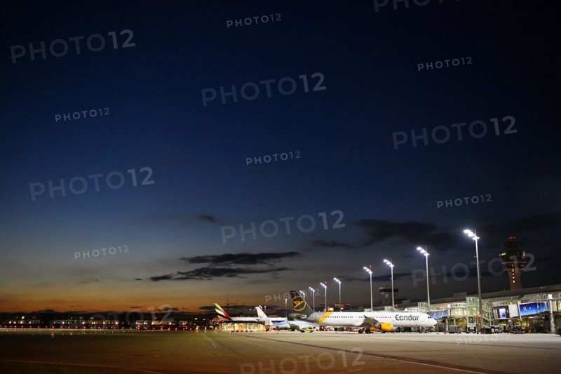 Apron West with Terminal 1 at night with tower and Condor and TUI fly