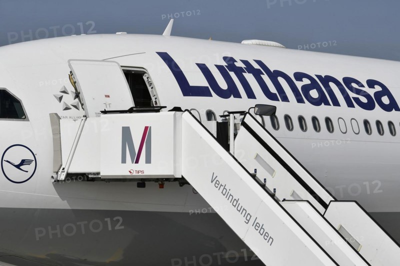 Lufthansa aircraft with passenger stairs on the east apron in front of Terminal 2