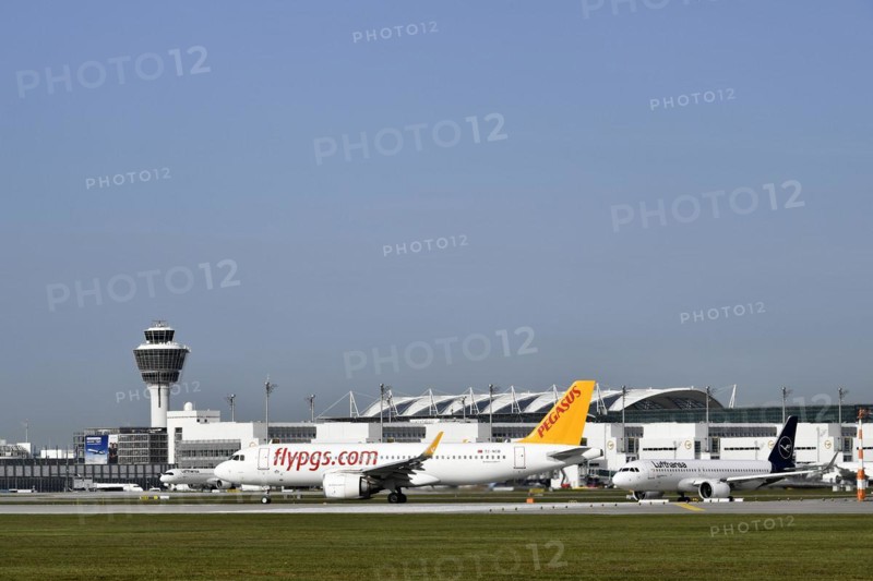 Pegasus Boeing B737 waiting for take-off clearance on runway south with tower