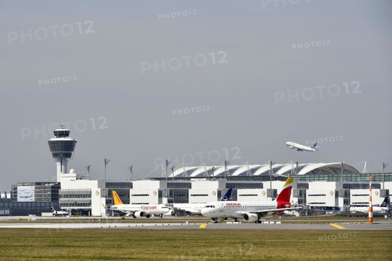 Iberia and Pegasus aircraft taxiing in front of Terminal 2