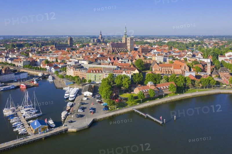 Aerial view over the waterfront and marina of the Hanseatic City of Stralsund along the Strelasund in summer