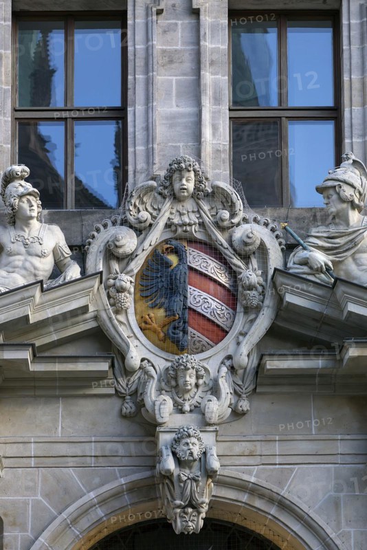 Coat of arms and sculptures on the right-hand entrance portal of the historic Wolf Town Hall