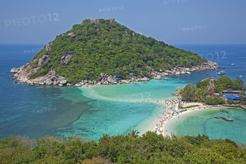Western tourists sunbathing on beach of Ko Nang Yuan