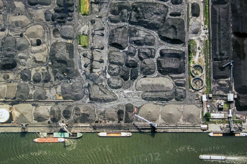 Aerial view over bulk carriers loading coal at SEA-invest