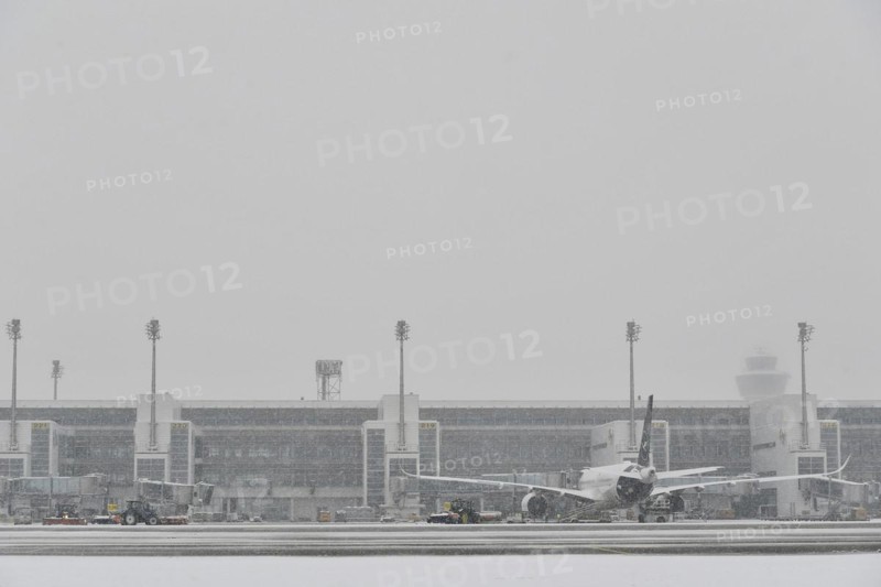 Snow clearing machines and snow removal tractors clearing snow on the east apron