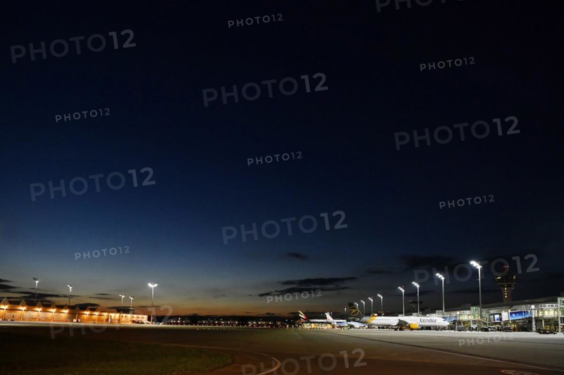 Apron West with Terminal 1 at night with tower and Condor and TUI fly