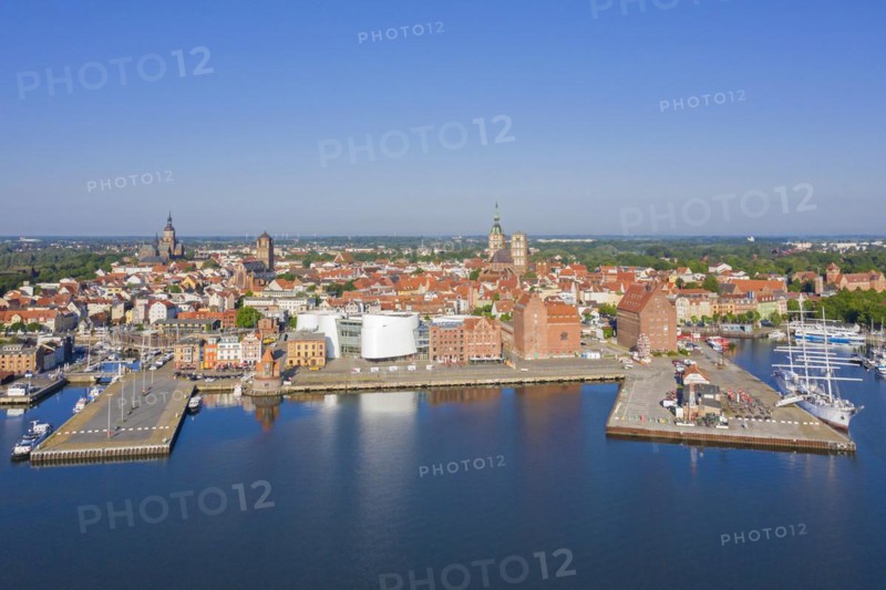 Aerial view over public aquarium Ozeaneum and three-mast barque Gorch Fock docked in harbour of the city Stralsund