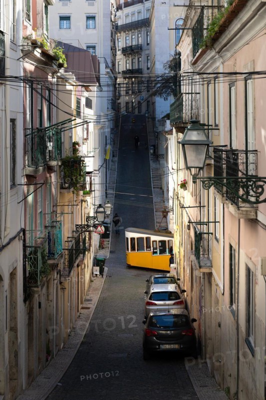 Old houses in narrow alleys and historic streets. Old house fronts in the morning and in the sunshine