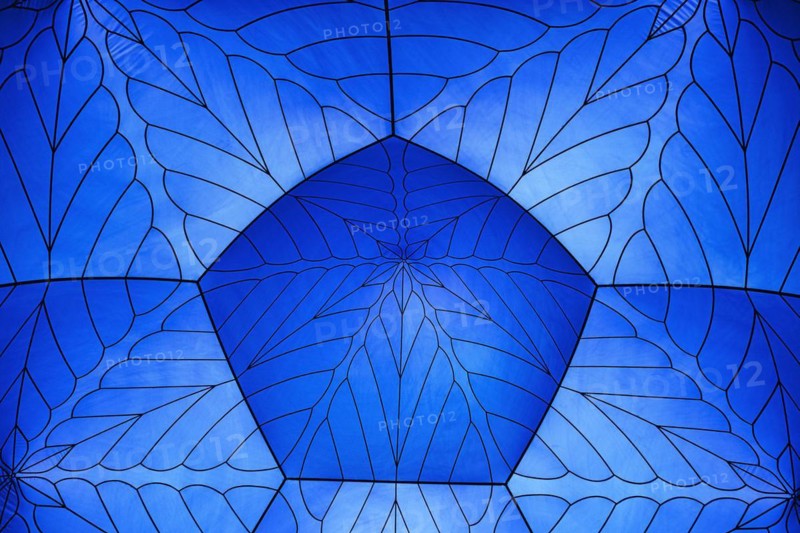 Incidence of light through a blue tent dome