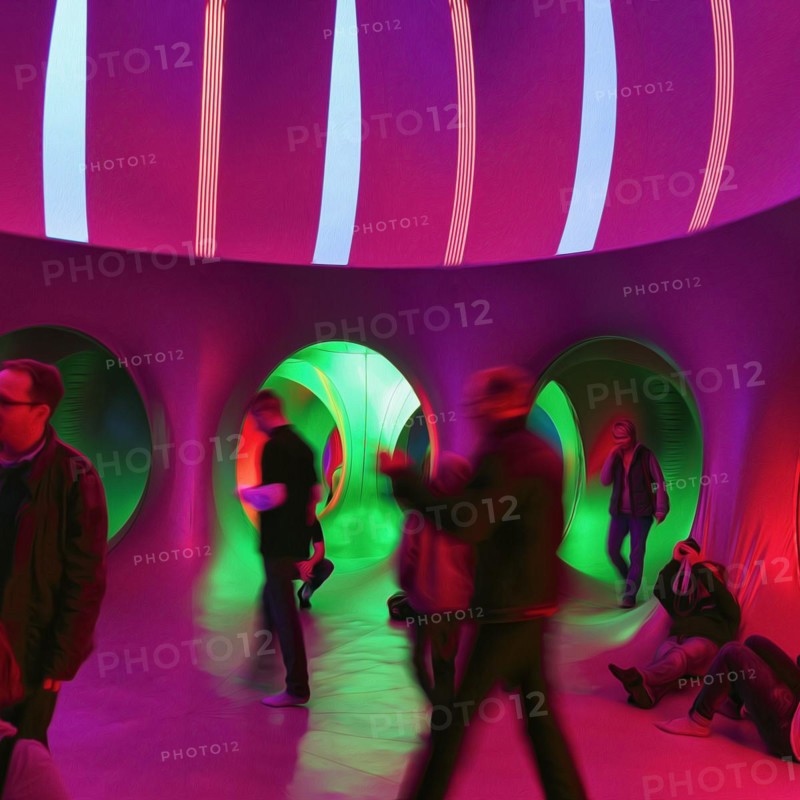 Anonymous crowd exploring colourful walk-in tent