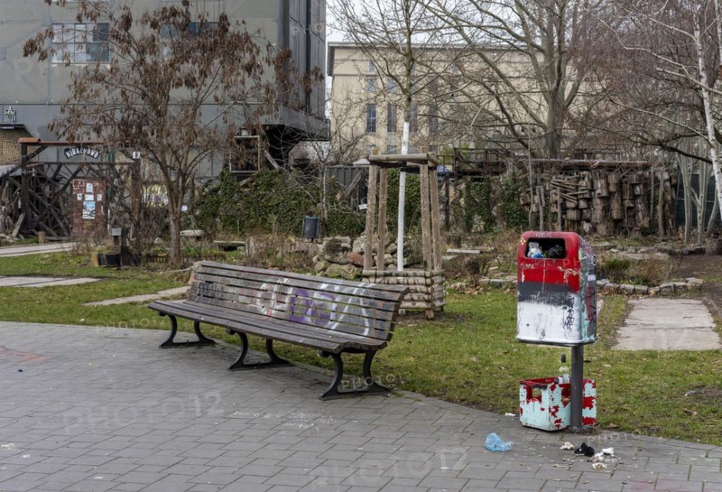 Soiled wastepaper bin in the park