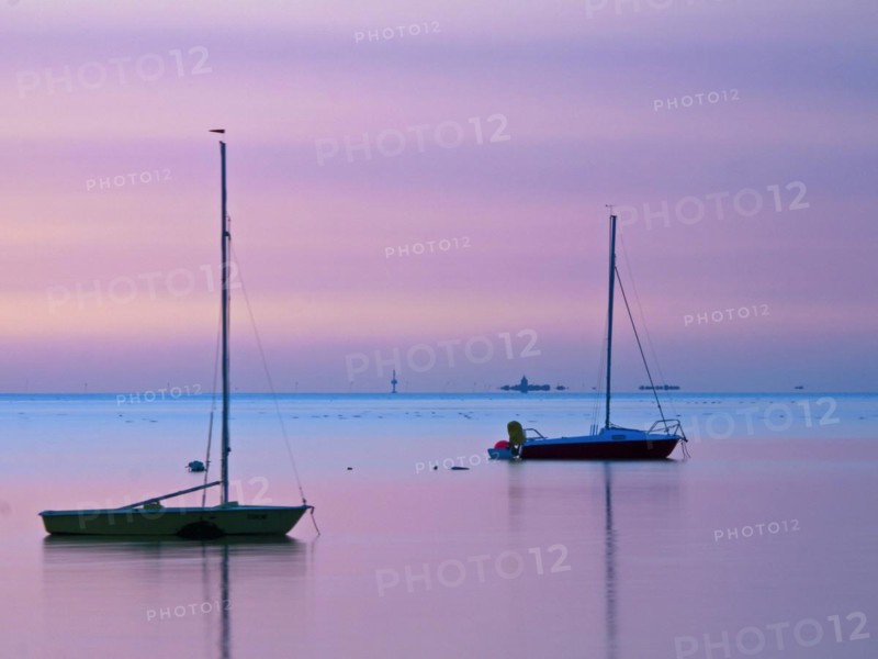 Two sailing boats on the North Sea in the evening light