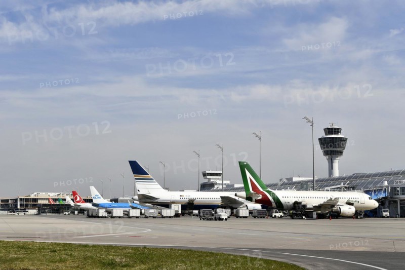 Aircraft on check-in position at Terminal 1 with tower