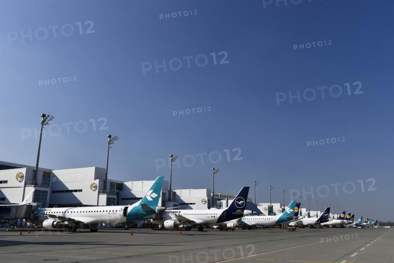 Lufthansa and Air Dolomiti aircraft parked in position at Terminal 2