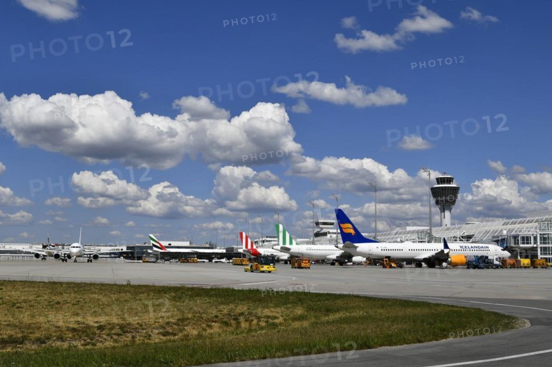 Aircraft parking on position at Terminal 1 with tower