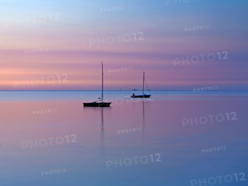 Two sailing boats on the North Sea in the evening light