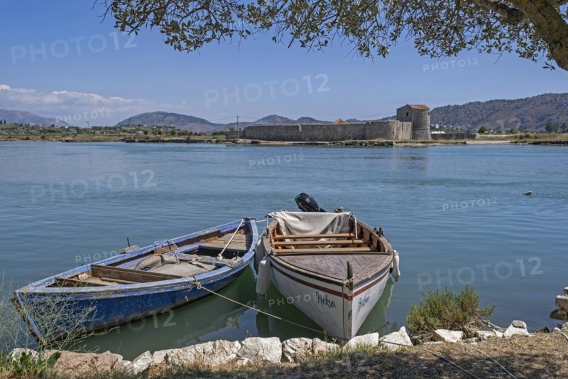 Fishing boats and 15th century Venetian Triangular Castle along the Vivari Channel near Butrint National Park