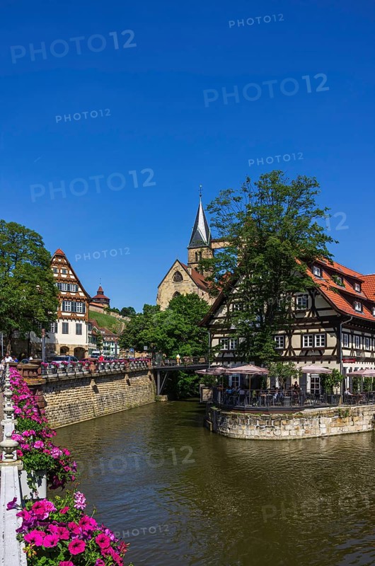 View from the Agnes Bridge over the Rossneckar Canal onto beer garden restaurants in a half-timbered ambience