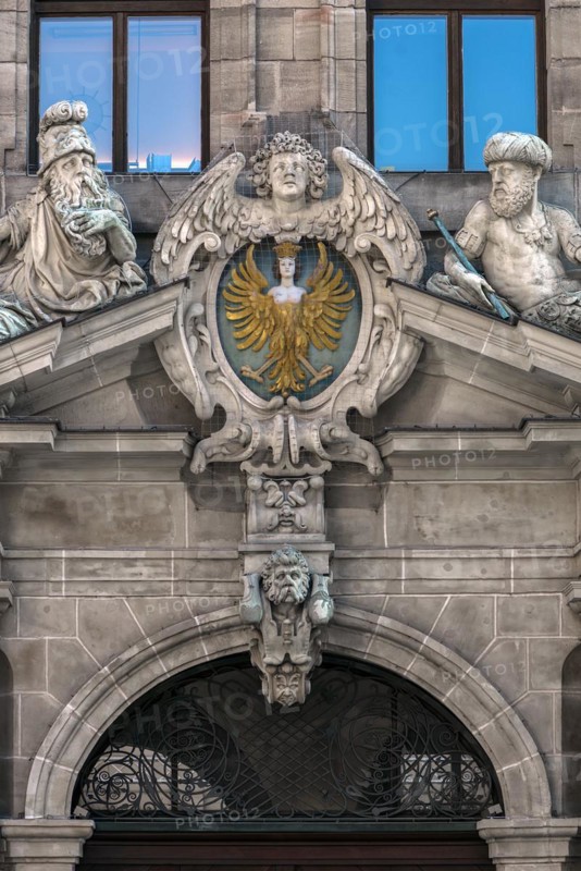 Coat of arms and sculptures on the upper entrance portal of the historic Wolf Town Hall