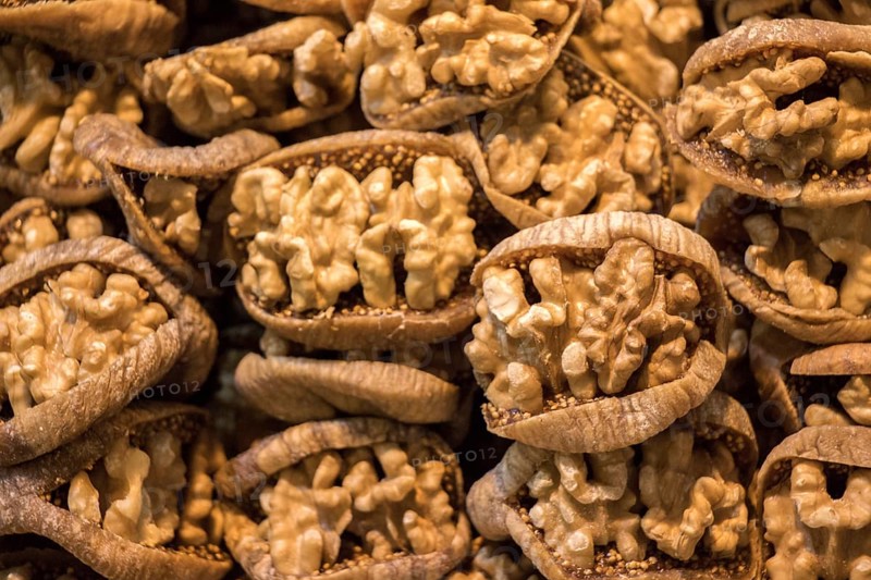 Pile of whole fresh walnuts without nutshells in fig