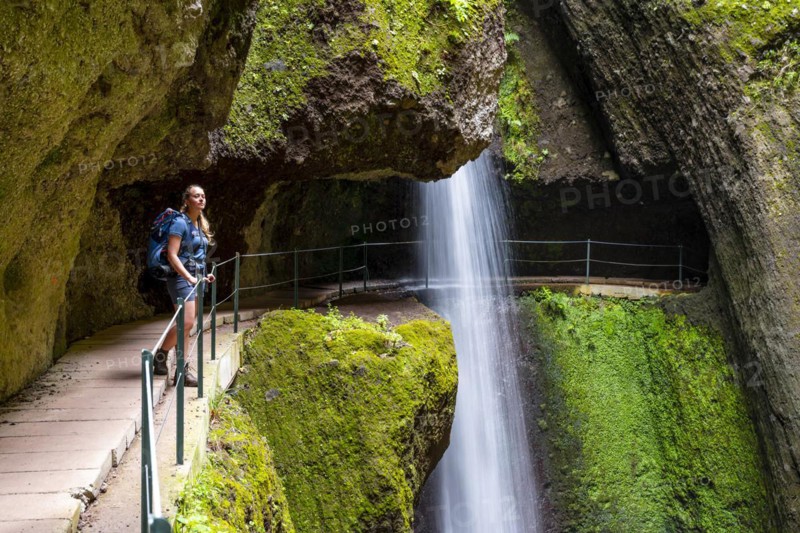 Hiker at Levada do Moinho, Waterfall in a gorge, Ponta do Sol, Madeira, Portugal, Europe