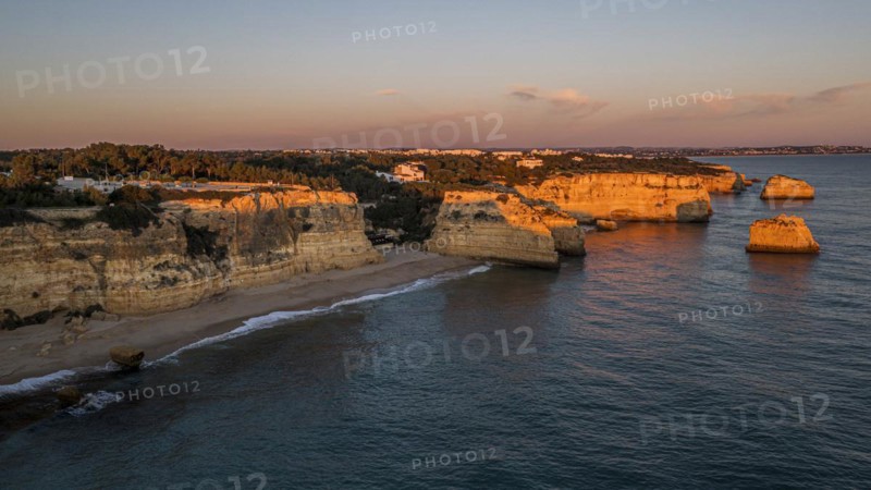 Sunset at Praia da Marinha, rocks and cliffs, steep coast in the Algarve, Portugal, Europe